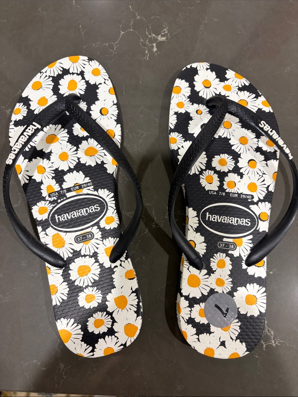 Havaianas Black Flip Flops with White & Yellow Daisy Print